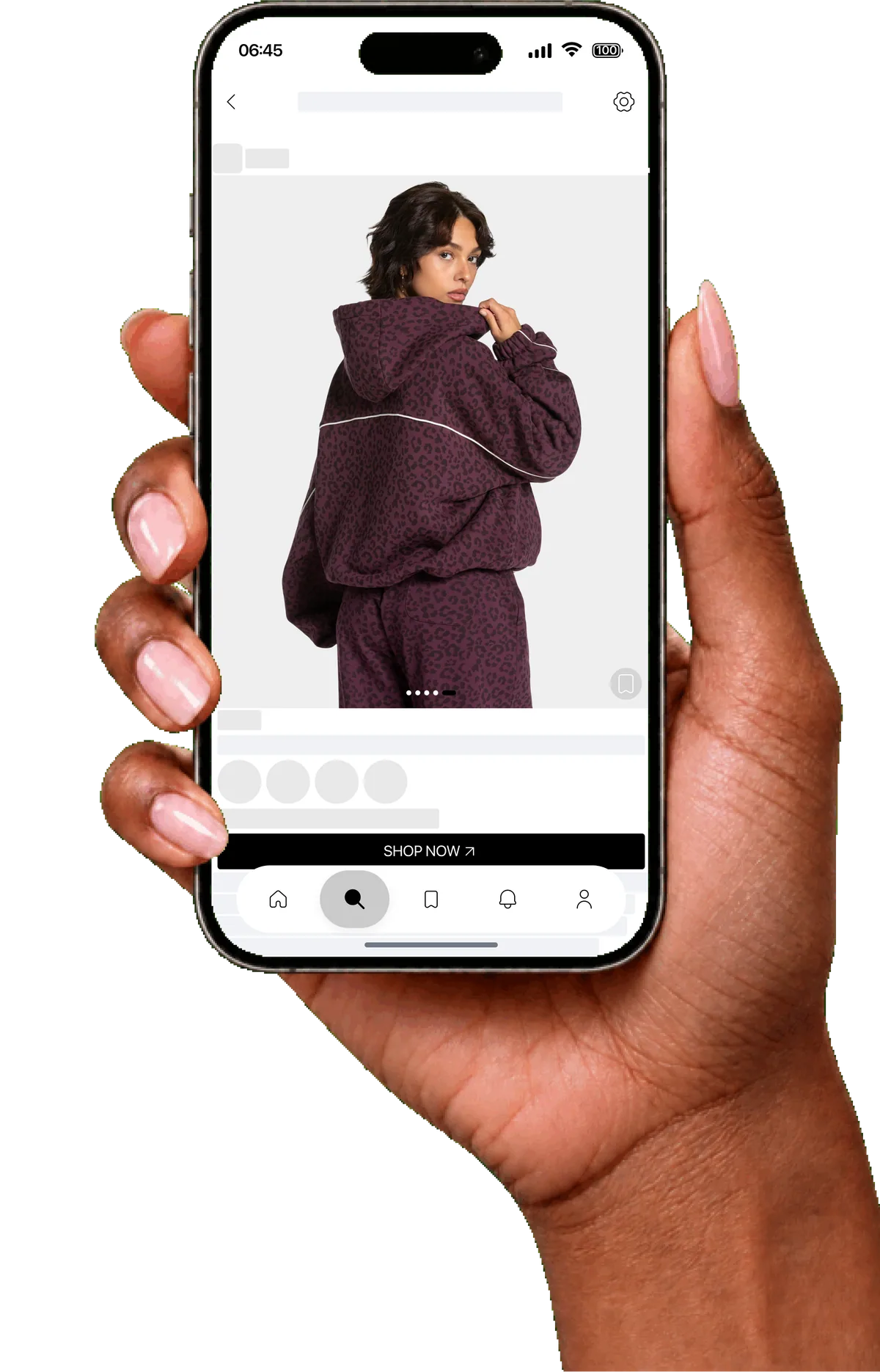 A hand holding a phone showing an outfit in the imisya app